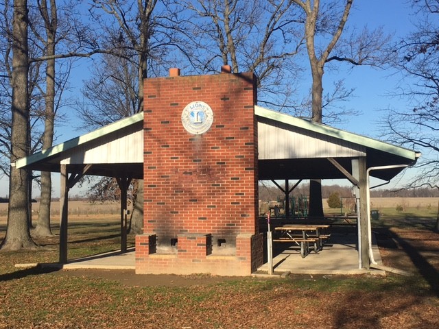 The park shelter featuring brick grills and the Lions Club logo